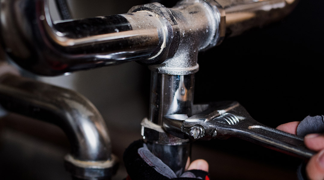 Plumbing, Electrical & HVAC Services in Carlsbad Technician working on residential Plumbing, Electrical & HVAC system