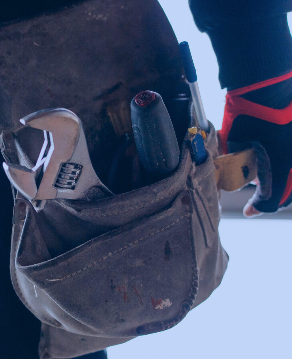 Reliable Carlsbad Handyman Providing Home Repair Services Close-up of a handyman tool belt with wrench and screwdrivers